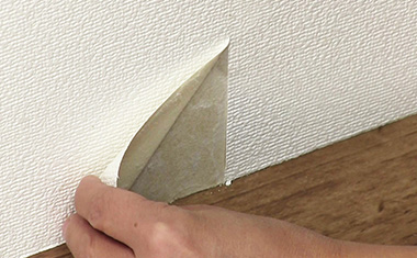 Peel off the wallpaper.