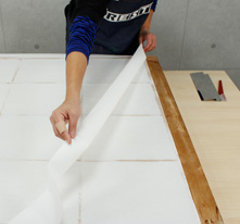 After cutting the excess paper,remove the excess paper and	 the tape used to temporarily affix the paper to the frame.